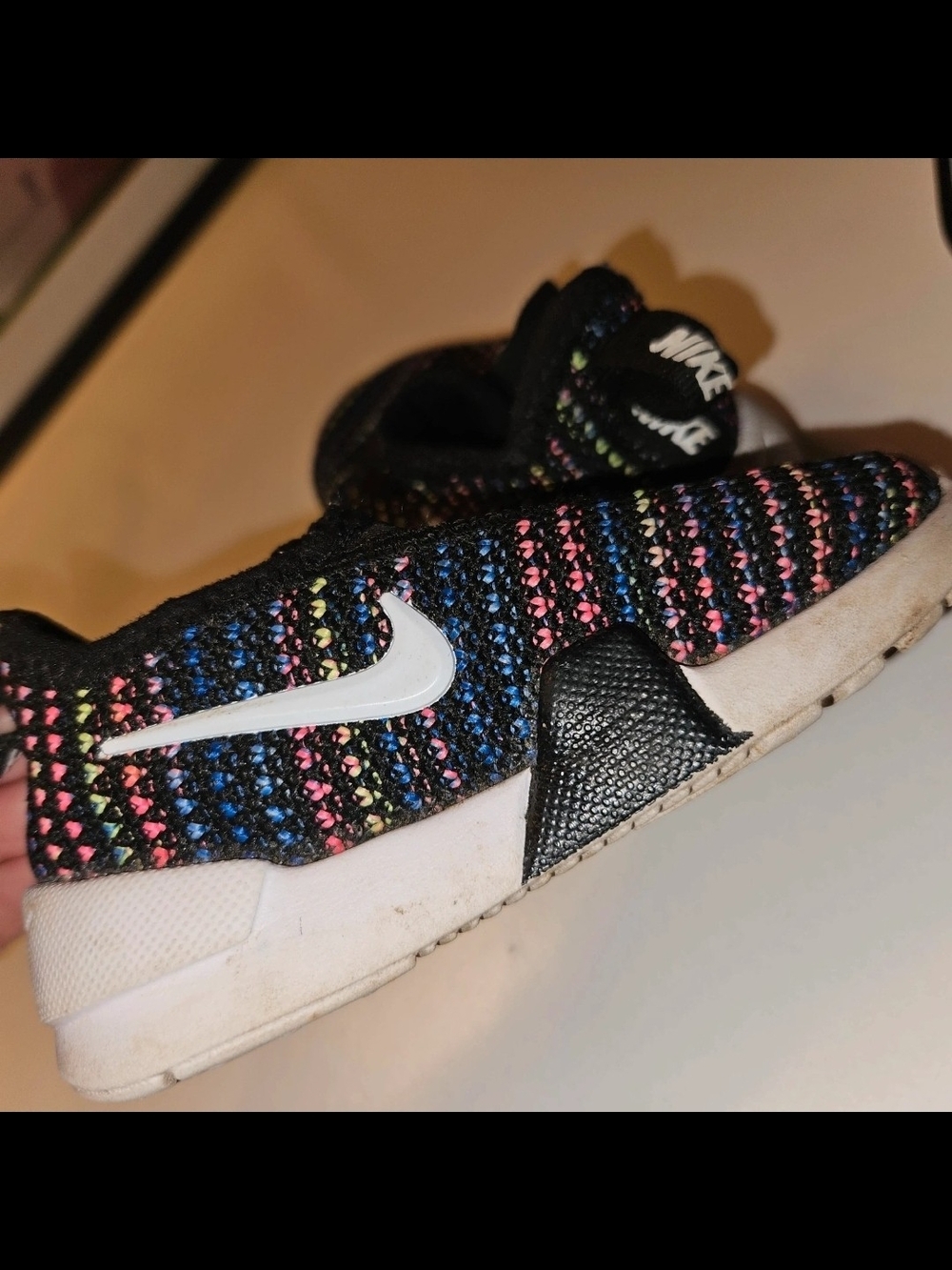 Nike Kids Slip-On Sneakers in Black with Blue, Pink & Yellow Accents